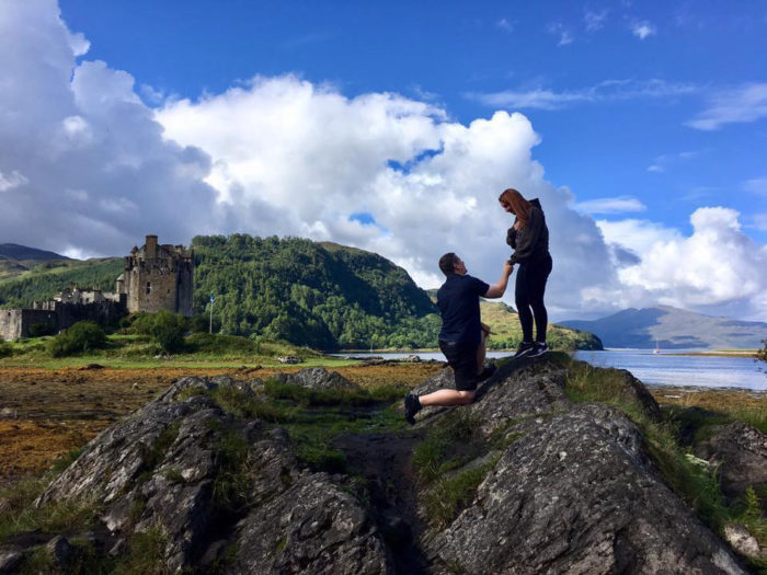 a man standing on a rocky hill